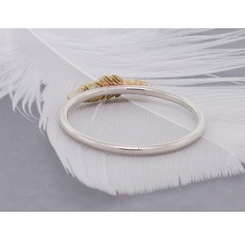 Gold feather on a silver band stack ring