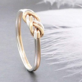 Gold and silver climbing knot ring