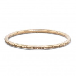 Skinny  gold stack ring textured with small lines