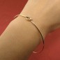 Solid gold love knot bangle