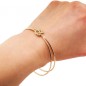 Solid gold double love knot bangle bracelet