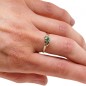 Emerald and gold climbing knot ring