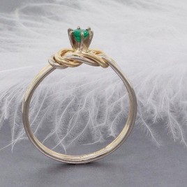 Emerald and gold climbing knot ring