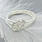 Knotted mother daughter ring