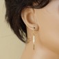 Boucles d'oreilles pendantes barre de Mobius en or massif