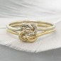 Double love knot ring with tiny diamonds