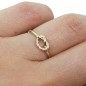 Solid gold love knot ring with tiny diamonds
