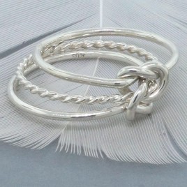 Double love knot ring with twisted center band