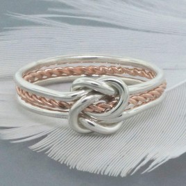 Gold and Silver double love knot ring with a twist