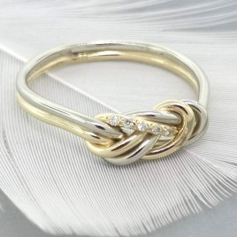 Gold climbing knot engagement ring with small diamonds - larger version