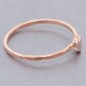 Tiny heart stacking ring in solid gold