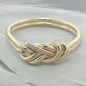 Gold climbing knot engagement ring with small diamonds - larger version