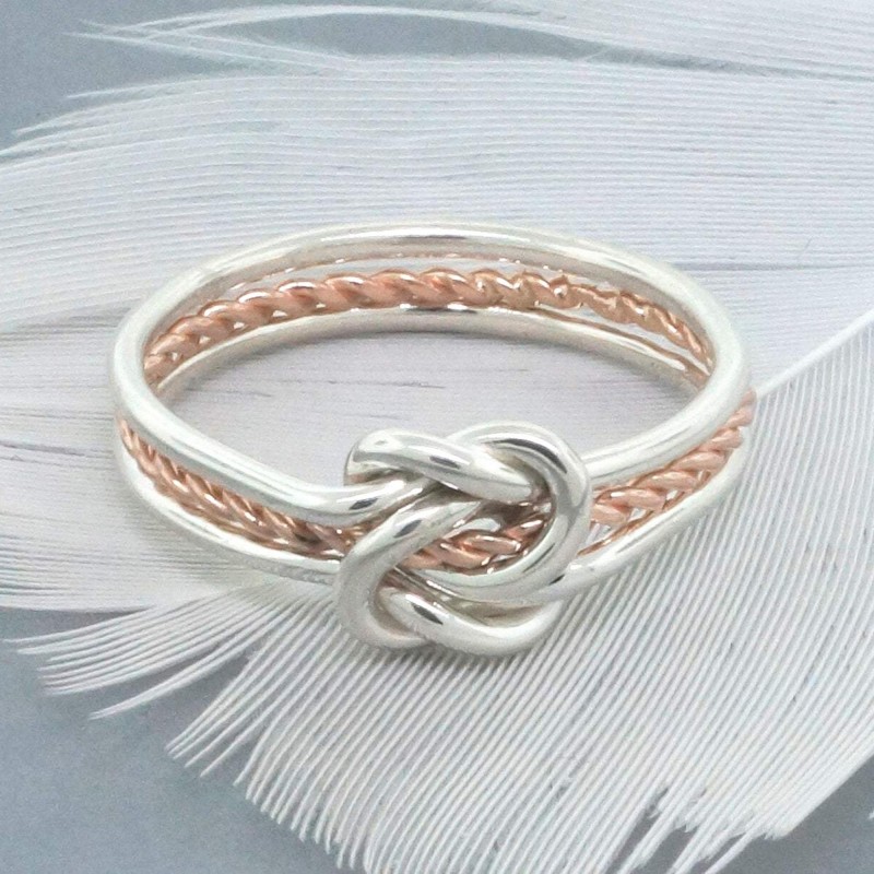 gold-and-silver-double-love-knot-ring-with-a-twist (1).jpg